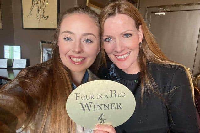 Lauren and Helen Milner are pictured with the Four In A Bed trophy.