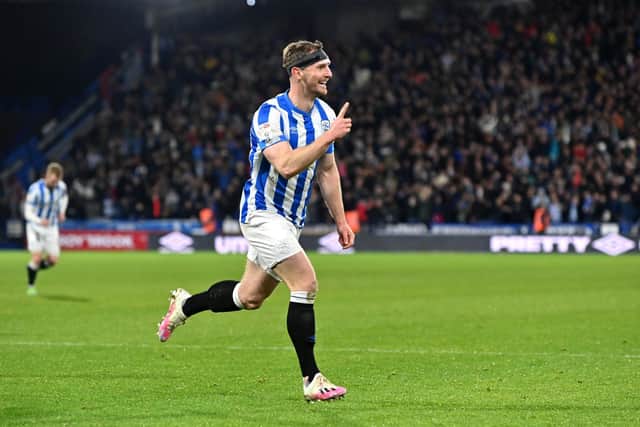 Tom Lees celebrates his second goal for Huddersfield Town. Picture: Bruce Rollinson.