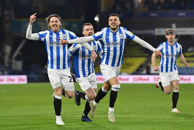Huddersfield Town players celebrate Danel Sinani's opener against Peterborough United. Picture: Bruce Rollinson.