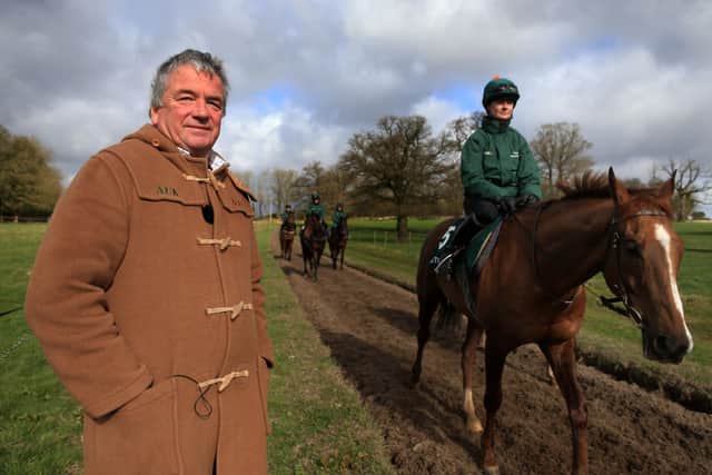 Trainer Nigel Twiston-Davies overlooks his string of horses on his gallops near Cheltenham.