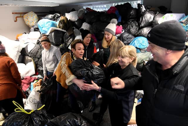 Christa Ackroyd in Halifax with helpers taking aid to Ukraine on Swales Moor Road. Picture: Simon Hulmne.