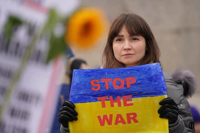 People take part in a demonstration in Trafalgar Square, London, to denounce the Russian invasion of Ukraine.