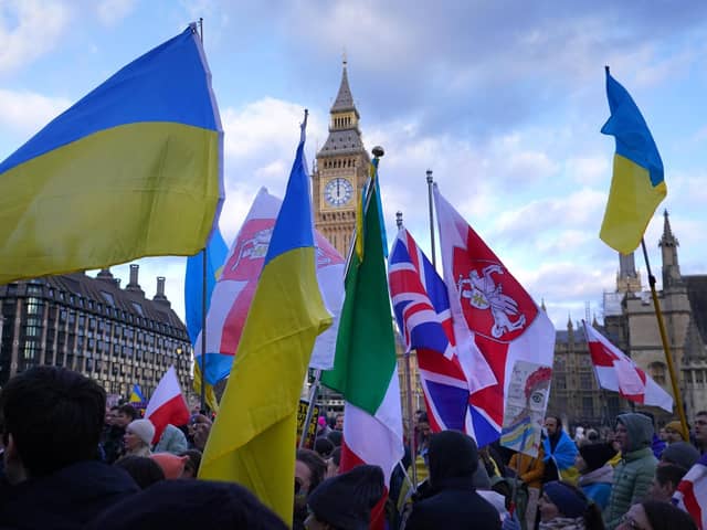 People take part in a demonstration in Parliament Square, London, to denounce the Russian invasion of Ukraine.