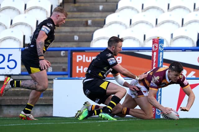 Huddersfield Giants' Innes Senior (right) scores his side's third try of the game during the Betfred Super League match at the John Smith's Stadium, Huddersfield. Picture date: Sunday March 6, 2022. PA Photo. See PA story RUGBYU Huddersfield. Photo credit should read: Nick Potts/PA Wire.RESTRICTIONS: Use subject to restrictions. Editorial use only, no commercial use without prior consent from rights holder.