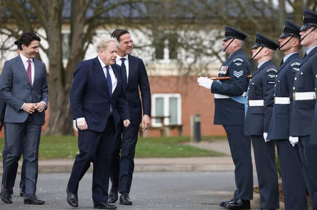 Canadian Prime Minister Justin Trudeau, Prime Minister Boris Johnson and Dutch Prime Minister Mark Rutte reviewing troops during a visit to RAF Northolt in London.