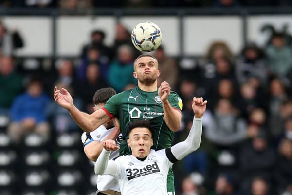 Rising to the task: Barnsley’s Carlton Morris, back, in action at Derby County on Saturday. (Picture: Nigel French/PA)