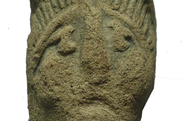 A Roman pottery head.