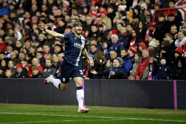 Tom Lees celebrates his goal for Huddersfield Town at the City Ground. Picture: PA.