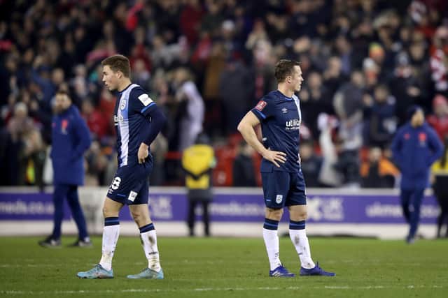 Huddersfield Town's Carel Eiting (left) appears dejected after the Emirates FA Cup fifth round match at Nottingham Forest (Picture: PA)