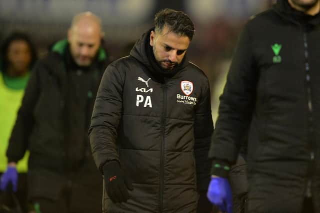 A dejected looking Poya Asbaghi exits at the final whistle after his Barnsley side conceded a costly late leveller against Stoke City. Picture: Bruce Rollinson.