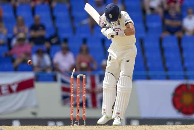 Got him: England's captain Joe Root is dismissed by West Indies' Kemar Roach as the top order failed again. (AP Photo/Ricardo Mazalan)