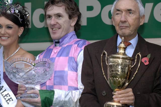 Sir Robert Ogden and jockey Tony McCoy celebrate after winning the Paddy Power Gold Cup Handicap Chase on Exotic Dancer at Cheltenham racecourse in 2006.