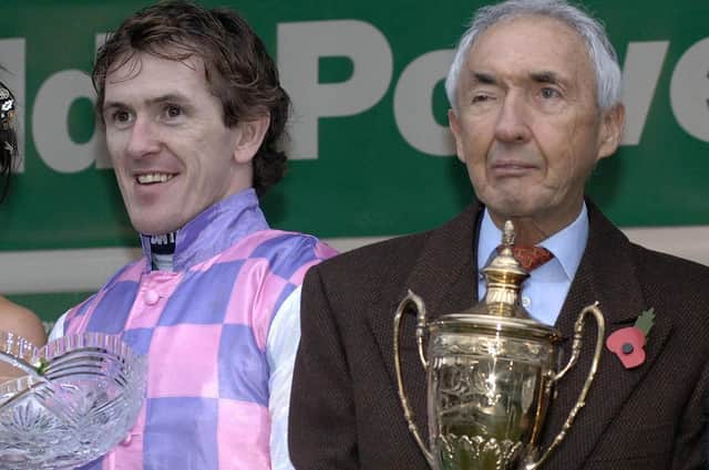 Owner Sir Robert Ogden (right) and jockey Tony McCoy celebrate after winning the Paddy Power Gold Cup Handicap Chase on Exotic Dancer at Cheltenham racecourse in 2006.