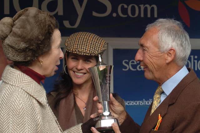 The Princess Royal presents the Seasons Holidays Queen Mother Champion Chase trophy to the owner of Voy Por Ustedes, Sir Robert Ogden, at the Cheltenham Festival.