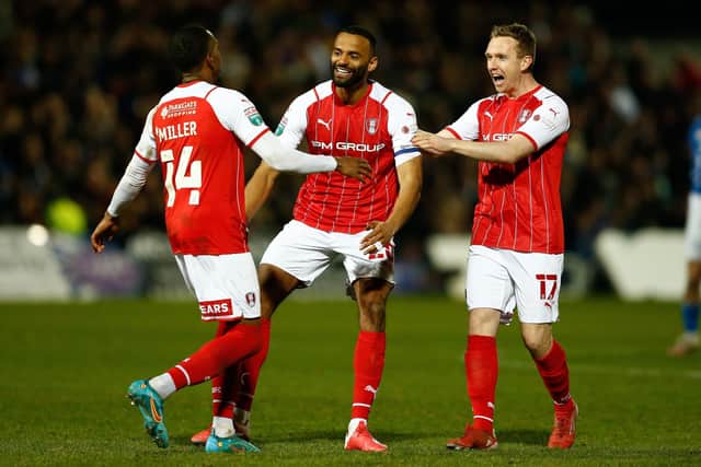 Rotherham United's Mickel Miller celebrates with team-mates after scoring their team's final penalty.
