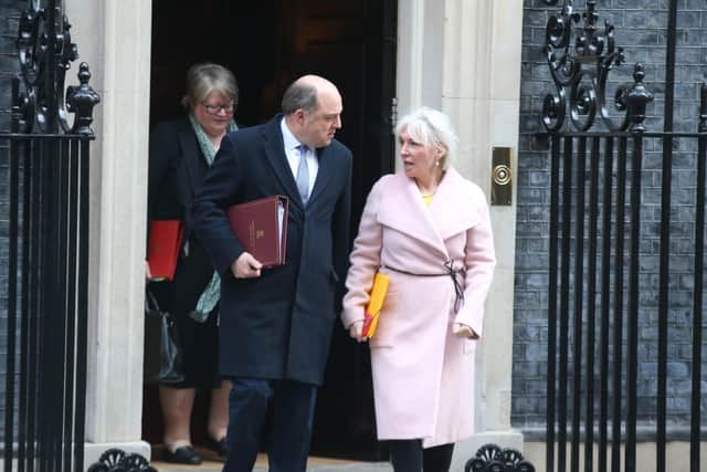 Defence Secretary Ben Wallace chats to Nadine Dorries, the Culture Secretary, following this week's Cabinet meeting.