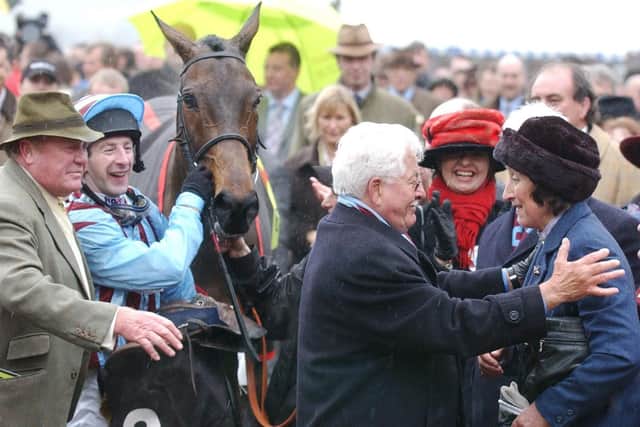 Owner Jim Lewis embraces Henrietta Knight (right) after Best Mate's third successive win in the Cheltenham Gold Cup.