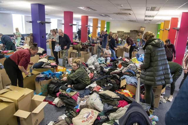 A call out for volunteers to help sort bags and boxes of items - donated by the community and by businesses - has seen more than 150 people converge on the warehouse to play their part in collecting an estimated eight tons of aid.