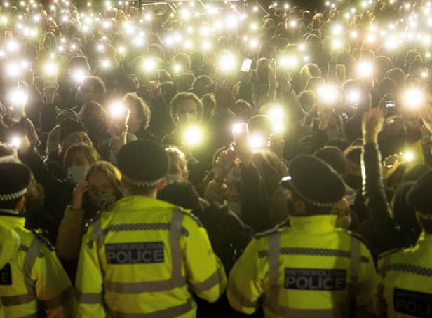 File photo dated 13/03/21 of people in the crowd turning on their phone torches in Clapham Common, London, for a vigil for Sarah Everard.