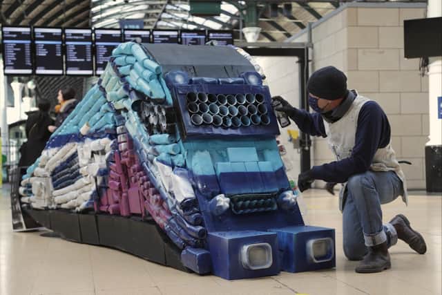Hull based artist Andy Pea puts the finishing touches to a sculpture made entirely of recycled materials at Hull Paragon Station ahead of Global Recycling Day.