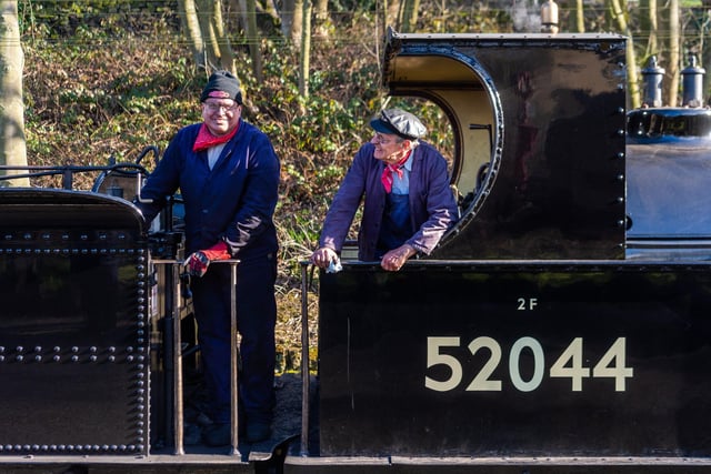 (left to right) Julian Jones, fireman, working alongside Nicholas Helliwell, train driver of the Lancashire and Yorkshire Railway Class 25 Ironclad 0-6-0 No.52044 at Ingrow West Station, near Keighley.