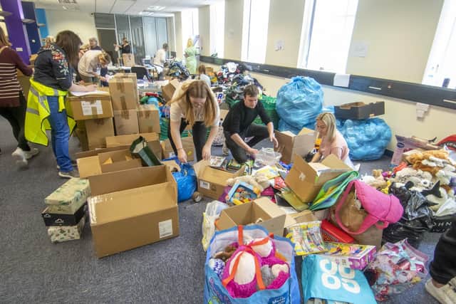 Volunteers at Dean Clough Mills in Halifax sort through donations and box up vital clothing and toiletries to aid Ukrainian refugees. Photo: Tony Johnson.