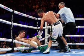 Michael Conlan falls out of the ring after being knocked out by Leigh Wood in their WBA Featherweight World Title contest at the Motorpoint Arena, Nottingham. (Picture: Zac Goodwin/PA Wire)
