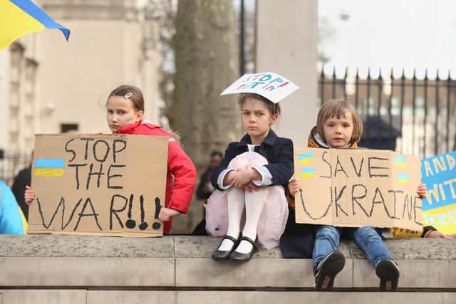 Maia aged 8, Kira aged 8 and Alexander aged 5 at a demonstration organised by London EuroMaidan and British-Ukrainian volunteers outside Downing Street, London, to show solidarity with Ukraine following the invasion by Russia.