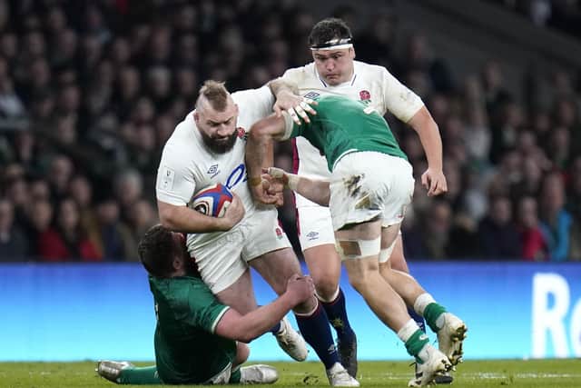 England's Joe Marler (centre) is tackled by Ireland's Tadhg Furlong (left) and Josh Van Der Flier (Picture: PA)