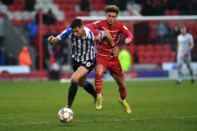 Sheffield Wednesday's Jordan Storey battles with Doncaster Rovers' Josh Martin
 Picture: Jonathan Gawthorpe
