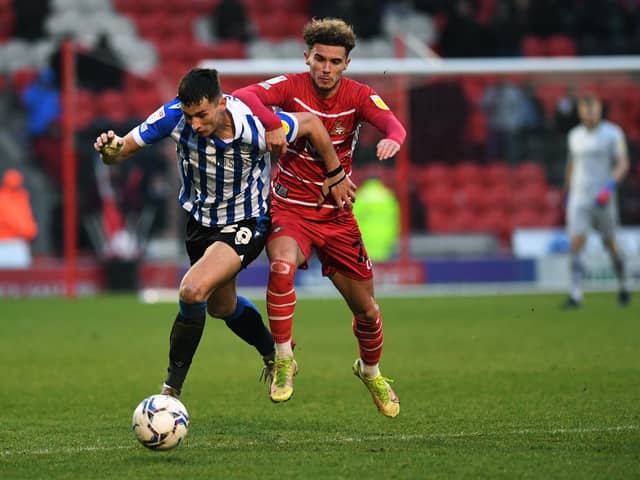 Sheffield Wednesday's Jordan Storey battles with Doncaster Rovers' Josh Martin Picture: Jonathan Gawthorpe