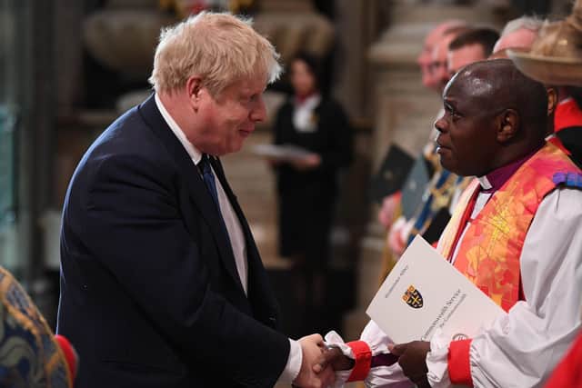 Prime Minister Boris Johnson shakes hands with  Lord Sentamu (right) upon arrival at the Commonwealth Service at Westminster Abbey in London on Commonwealth Day.