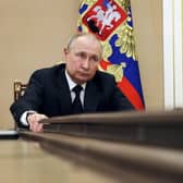 Russian President Vladimir Putin chairs a meeting with members of the government via teleconference in Moscow, Thursday, March 10, 2022. (Mikhail Klimentyev, Sputnik, Kremlin Pool Photo via AP)