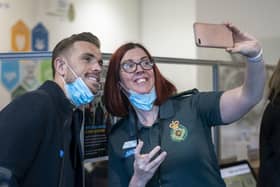 England star and Liverpool captain Jordan Henderson (left) has a selfie taken with Head of Operations Claire Lindsay (right) during a visit to the Yorkshire Ambulance Service at the Trust Headquarters, in Wakefield.
