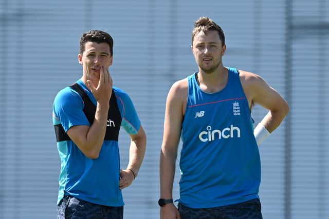 Yorkshire's Matthew Fisher and England team-mate Ollie Robinson chat during a nets session at Kensington Oval on Monday. Picture: Gareth Copley/Getty Images