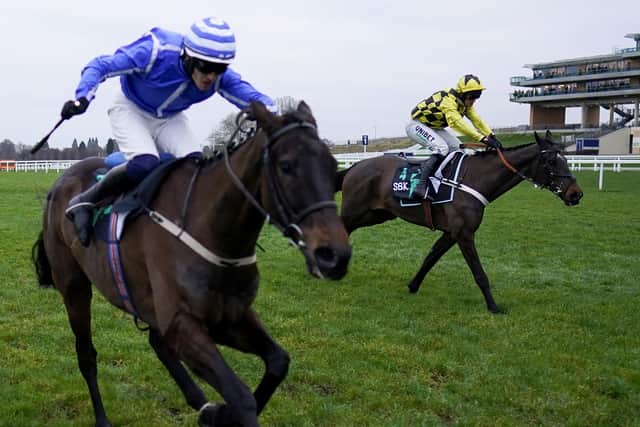 Shishkin and Nico de Boinville (yellow cap) get the better of Energumene in the Clarence House Chase at Ascot.