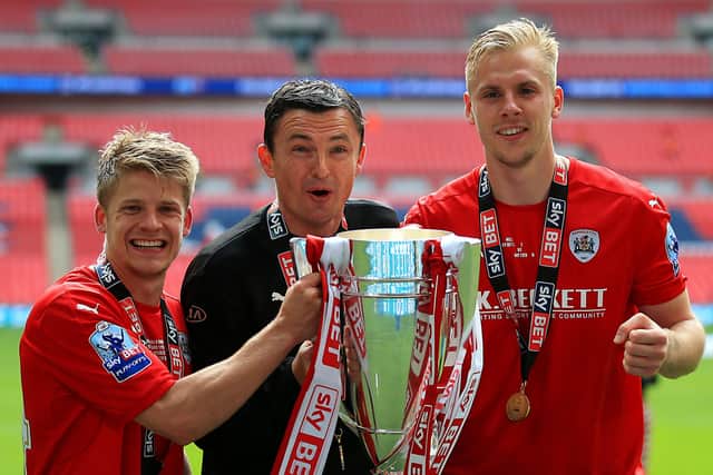 GOING UP: Barnsley's Lloyd Isgrove, manager Paul Heckingbottom and Marc Roberts celebrate after winning the League One Play-Off Final at Wembley in 2016. Picture: Nigel French/PA