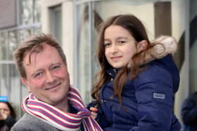 Richard Ratcliffe, with his daughter Gabriella, outside his North London home ahead of his wife Nazanin Zaghari-Ratcliffe's return (PA)