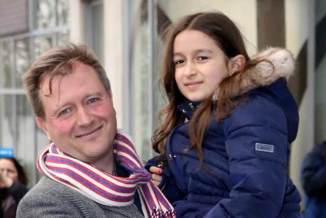 Richard Ratcliffe, with his daughter Gabriella, outside his North London home ahead of his wife Nazanin Zaghari-Ratcliffe's return.