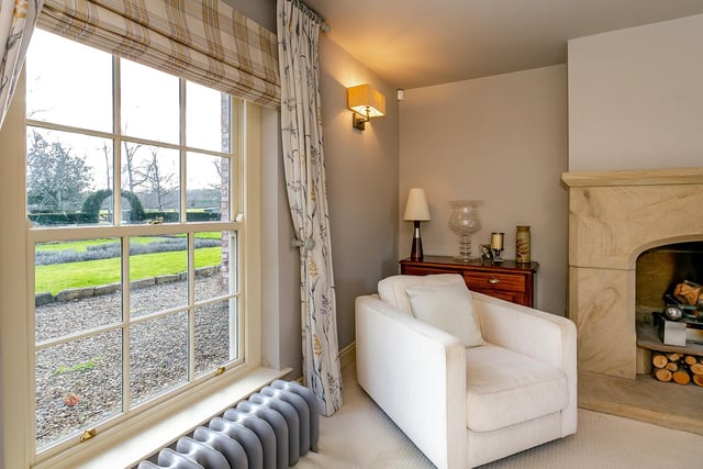 A Minster stone fireplace and real fire keep the second sitting room cosy