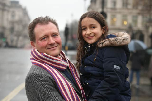 Richard Ratcliffe, with his daughter Gabriella, outside the Houses of Parliament in London