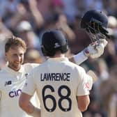 England's captain Joe Root celebrates scoring a century against West Indies during day one of their second cricket Test match at the Kensington Oval in Bridgetown, Barbados, Wednesday, March 16, 2022. (AP Photo/Ricardo Mazalan)