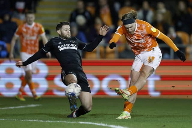 Blackpool's Josh (right) has a shot at goal under pressure from Sheffield United's Oliver Norwood (Picture: PA)