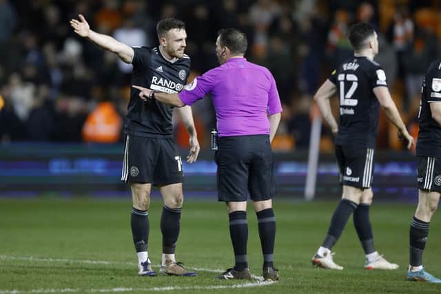 Sheffield United's Jack Robinson talks to the referee after the Sky Bet Championship match at Bloomfield Road (Picture: PA)