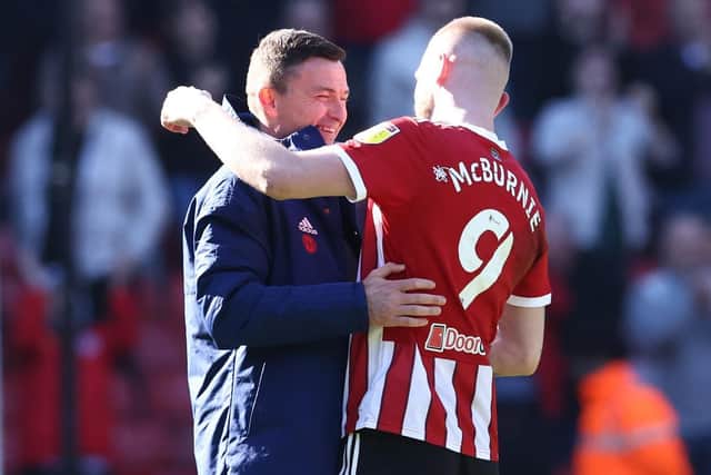MENTALITY: Paul Heckingbottom celebrates with Sheffield United substitute Oli McBurnie, who created Morgan Gibbs-White's second goal