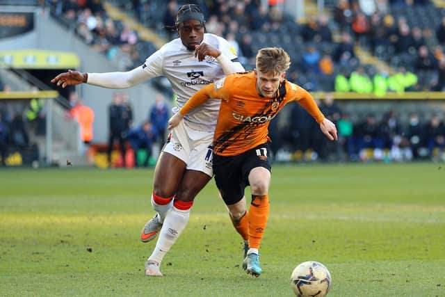 HOME DEFEAT: Hull City's Keane Lewis-Potter and Luton Town's Pelly Ruddock Mpanzu (left) battle for the ball during the Sky Bet Championship match at the MKM Stadium. Picture: Nigel French/PA Wire.