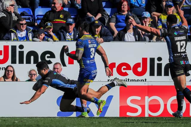 Wakefield Trinity's Mason Lino scores a spectacular try in the win over Warrington Wolves Picture: Alex Whitehead/SWpix.com