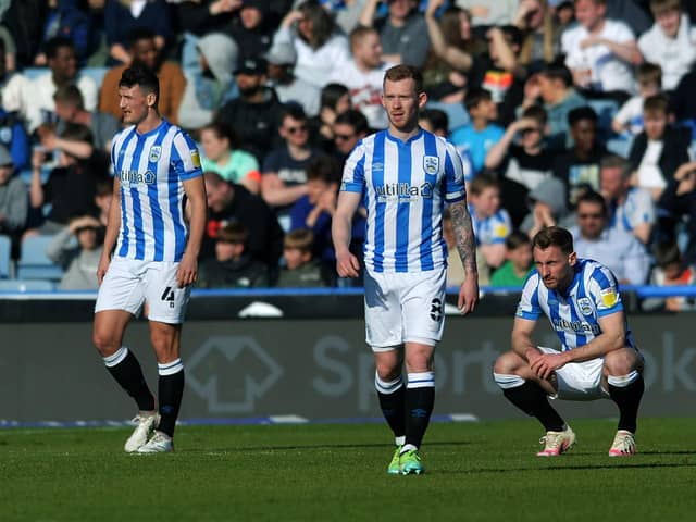 Dejected Town players after Bournemouth's second goal.  Picture: Jonathan Gawthorpe