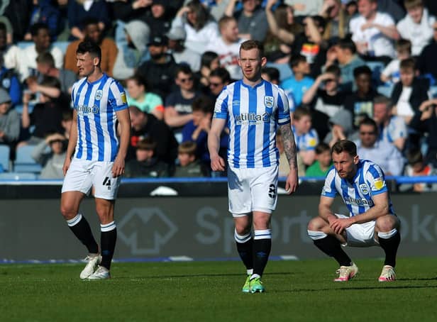 Dejected Town players after Bournemouth's second goal.  Picture: Jonathan Gawthorpe