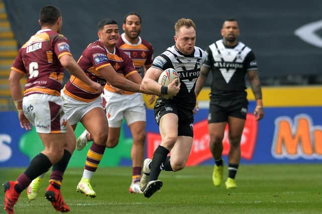 TOUGH DAY: Huddersfield Giants Will Pryce gets hold of Hull FC's Adam Swift Picture : Jonathan Gawthorpe